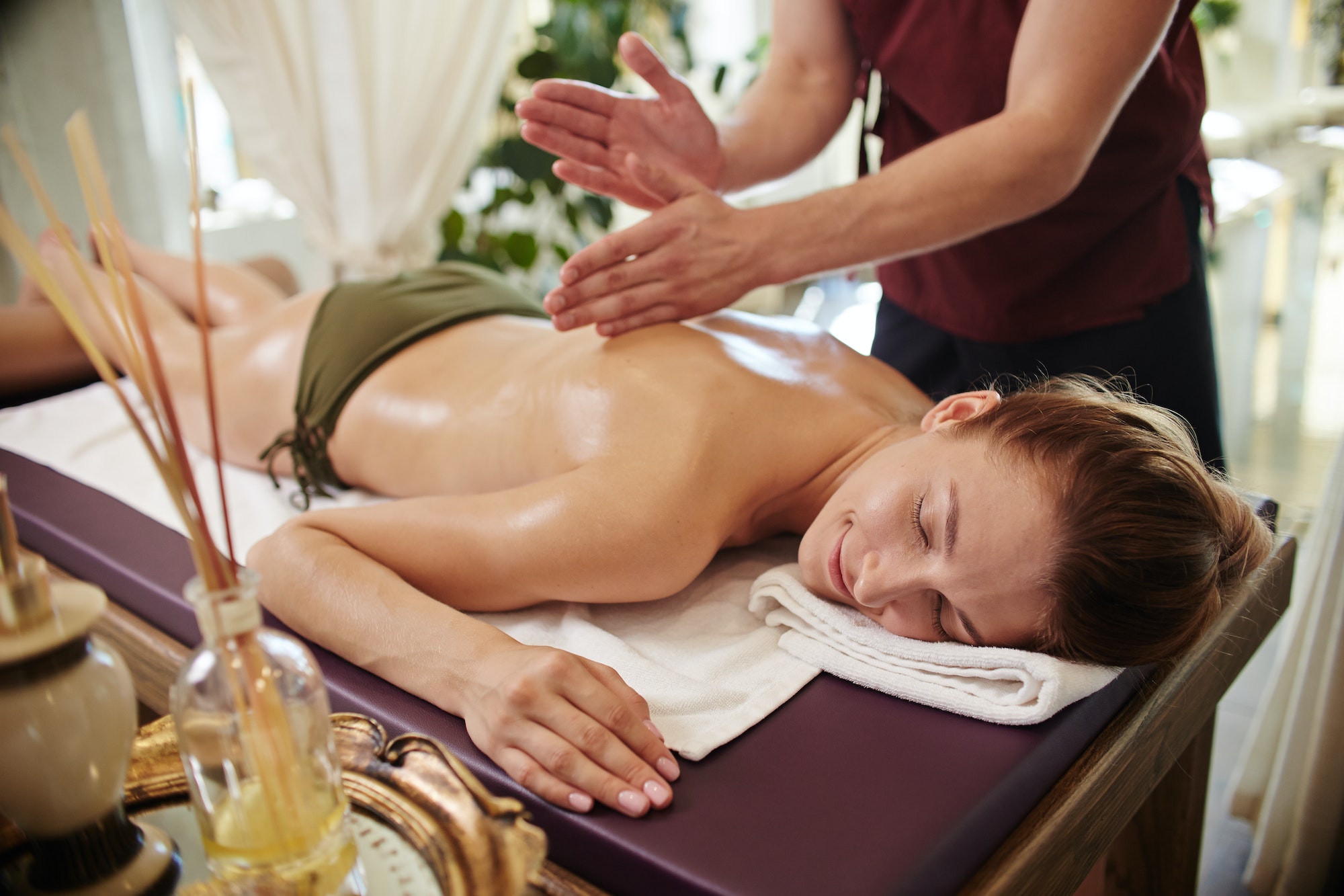 smiling-woman-enjoying-massage-in-spa.jpg